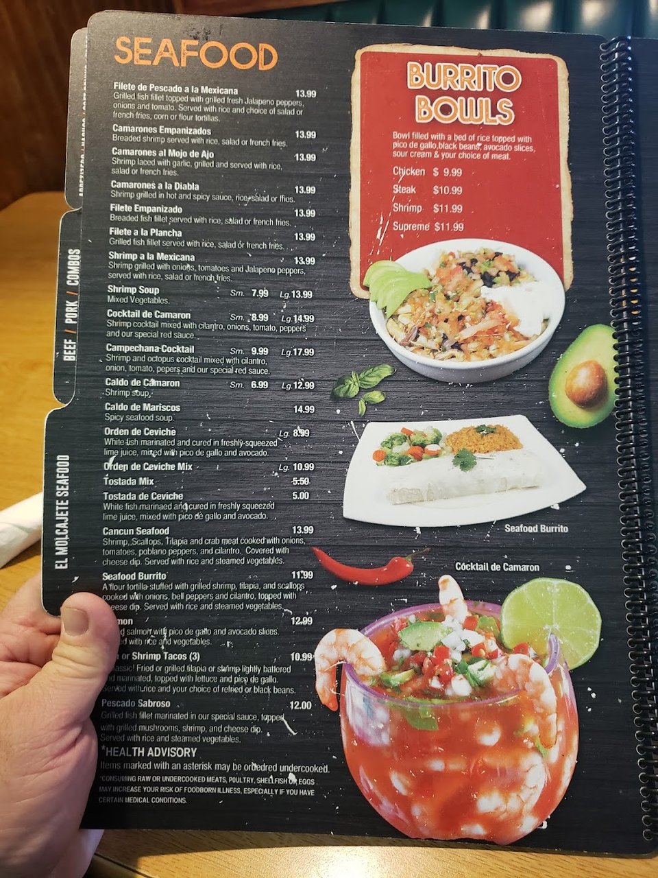 Close-up of a menu featuring assorted Mexican dishes.